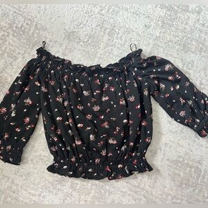 Express floral off the shoulder top.